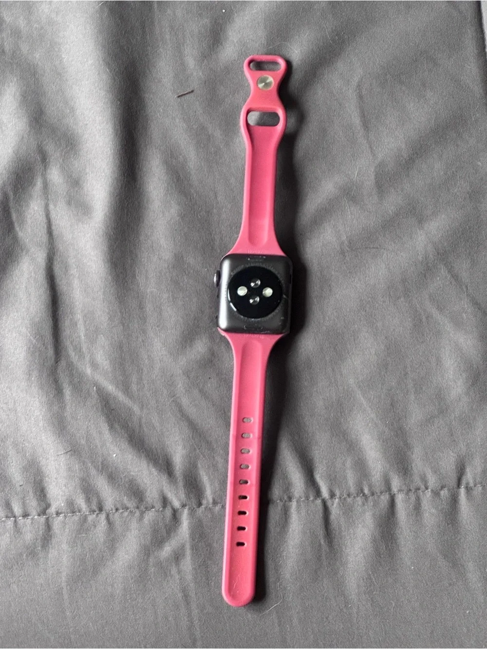 Apple Watch Series 3 with red silicone band